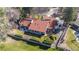 Aerial view of a home showing the expansive patio, red tile roof, and well-manicured back yard at 4749 Old Post Ct, Boulder, CO 80301