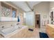 Spa-like bathroom with soaking tub, glass block shower, and tile accents at 4749 Old Post Ct, Boulder, CO 80301