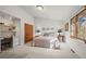 Bright bedroom with cozy sitting area and closet with paneled doors at 4749 Old Post Ct, Boulder, CO 80301
