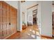 Welcoming foyer with beautiful tile flooring and a spacious open design with exposed beam ceilings at 4749 Old Post Ct, Boulder, CO 80301