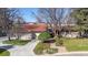 Inviting exterior showcasing a well-maintained lawn and a convenient two-car garage at 4749 Old Post Ct, Boulder, CO 80301