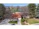 Charming front exterior with a red roof and picturesque views of the golf course and mountains at 4749 Old Post Ct, Boulder, CO 80301