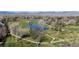 Scenic view of a golf course with water features and mountain views in the background at 4749 Old Post Ct, Boulder, CO 80301