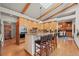 View of the kitchen including breakfast bar which is open to the dining room with fireplace at 4749 Old Post Ct, Boulder, CO 80301