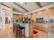 Well-equipped kitchen with island, breakfast bar, granite countertops, and wood cabinets at 4749 Old Post Ct, Boulder, CO 80301
