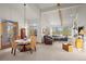 Bright living room with vaulted ceilings, fireplace, large windows, and a neutral color palette at 4749 Old Post Ct, Boulder, CO 80301