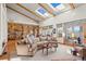 Spacious living room with lots of light, exposed beams, hardwood floors and built in bookshelves at 4749 Old Post Ct, Boulder, CO 80301