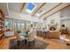 Bright and airy living room with large windows, skylights, and a cozy fireplace at 4749 Old Post Ct, Boulder, CO 80301