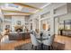 Cozy interior with skylights, exposed beams, fireplace, and adjacent dining area at 4749 Old Post Ct, Boulder, CO 80301