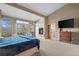 Main bedroom suite with a fireplace, sitting area, and en-suite bathroom at 4749 Old Post Ct, Boulder, CO 80301