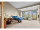Spacious main bedroom suite with sitting area, fireplace, and outdoor access at 4749 Old Post Ct, Boulder, CO 80301