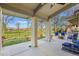 Spacious patio area with comfortable seating, a fire pit, and views of the golf course at 4749 Old Post Ct, Boulder, CO 80301