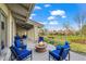 Patio area with cozy fire pit and golf course view at 4749 Old Post Ct, Boulder, CO 80301
