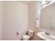 Clean half bath with modern fixtures, pedestal sink and convenient towel rack at 5892 W 94Th Pl, Westminster, CO 80031