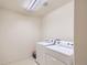 Functional laundry room equipped with a washer, dryer, and durable flooring at 5892 W 94Th Pl, Westminster, CO 80031