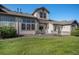 Lush backyard with patio, stone accents, and well-maintained landscaping at 23235 York Ave, Parker, CO 80138