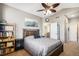Comfortable bedroom with ceiling fan, neutral walls, and cozy carpeting at 23235 York Ave, Parker, CO 80138