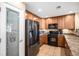 Modern kitchen features stainless steel appliances and ample cabinet space at 23235 York Ave, Parker, CO 80138