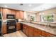Functional kitchen layout with bar seating open to the dining room at 23235 York Ave, Parker, CO 80138