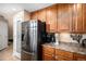 Well-equipped kitchen features stainless steel refrigerator and pantry at 23235 York Ave, Parker, CO 80138