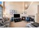 A cozy fireplace adds charm to this spacious living room at 23235 York Ave, Parker, CO 80138