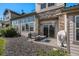 Relaxing outdoor patio with seating area, grill, and sliding glass door at 23235 York Ave, Parker, CO 80138