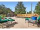 Backyard deck with green seating around a koi pond, perfect for relaxing and enjoying the outdoors at 10223 W 77Th Dr, Arvada, CO 80005
