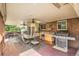 Spacious covered deck with ample seating, a large table, and an outdoor kitchen setup at 10223 W 77Th Dr, Arvada, CO 80005