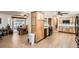 Spacious kitchen with wooden cabinets, black appliances, and an adjoining dining area at 10223 W 77Th Dr, Arvada, CO 80005