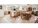 Open-concept kitchen with breakfast bar and seamlessly flowing into the dining area at 10223 W 77Th Dr, Arvada, CO 80005