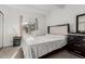 Bright bedroom features a comfortable bed, matching nightstand, and large windows at 9725 E Harvard Ave # 418, Denver, CO 80231