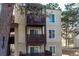 A view of the balconies of the apartment building, each with individual numbers at 9725 E Harvard Ave # 418, Denver, CO 80231