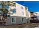 Apartment building exterior featuring multiple windows and a corner lot, on a sunny day at 9725 E Harvard Ave # 418, Denver, CO 80231