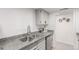 Kitchen featuring stainless steel appliances, granite countertops, and white cabinetry at 9725 E Harvard Ave # 418, Denver, CO 80231