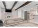 Open concept living room featuring brick fireplace and built-in shelving with sightlines to the kitchen at 9725 E Harvard Ave # 418, Denver, CO 80231
