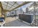 Backyard patio area features a hot tub, outdoor seating, and a covered area for relaxing at 3493 S Eudora St, Denver, CO 80222