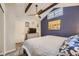 This is a well-lit bedroom with a vaulted ceiling, a ceiling fan, an entertainment center and carpeted flooring at 3493 S Eudora St, Denver, CO 80222