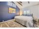 Cozy bedroom with a high vaulted ceiling, large windows, and a comfortable bed at 3493 S Eudora St, Denver, CO 80222