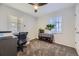 This is a well-lit bedroom with carpeted flooring and a desk space at 3493 S Eudora St, Denver, CO 80222