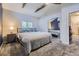 Comfortable bedroom featuring a vaulted ceiling, soft carpeted flooring, and a mirrored closet at 3493 S Eudora St, Denver, CO 80222
