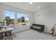 Bright bedroom with large windows, modern decor, and a comfortable layout for relaxation and productivity at 16722 Shoshone St, Broomfield, CO 80023