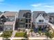 Beautiful three-story home with modern architecture, balconies, landscaping, and stunning curb appeal at 16722 Shoshone St, Broomfield, CO 80023