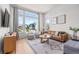 Inviting living room with large windows and neutral decor at 16722 Shoshone St, Broomfield, CO 80023