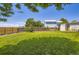 Large backyard with green grass, wooden fence, and a shed on the right at 4276 S Tempe Ct, Aurora, CO 80018