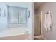 This bathroom has a tub, a shower, and light blue walls at 4276 S Tempe Ct, Aurora, CO 80018