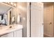 This is a bathroom with a sink, a mirror, and a door to a closet at 4276 S Tempe Ct, Aurora, CO 80018