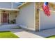 Home's inviting entrance features a lovely porch with decorative accents and an attached two-car garage at 4276 S Tempe Ct, Aurora, CO 80018