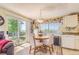 Cozy dining area and sliding glass door offering natural light and outdoor views at 4276 S Tempe Ct, Aurora, CO 80018