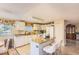 Bright kitchen features an island with seating, modern appliances, and ample cabinet space at 4276 S Tempe Ct, Aurora, CO 80018