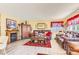 Cozy living room with a fireplace, wood floors, and comfortable leather furniture at 4276 S Tempe Ct, Aurora, CO 80018